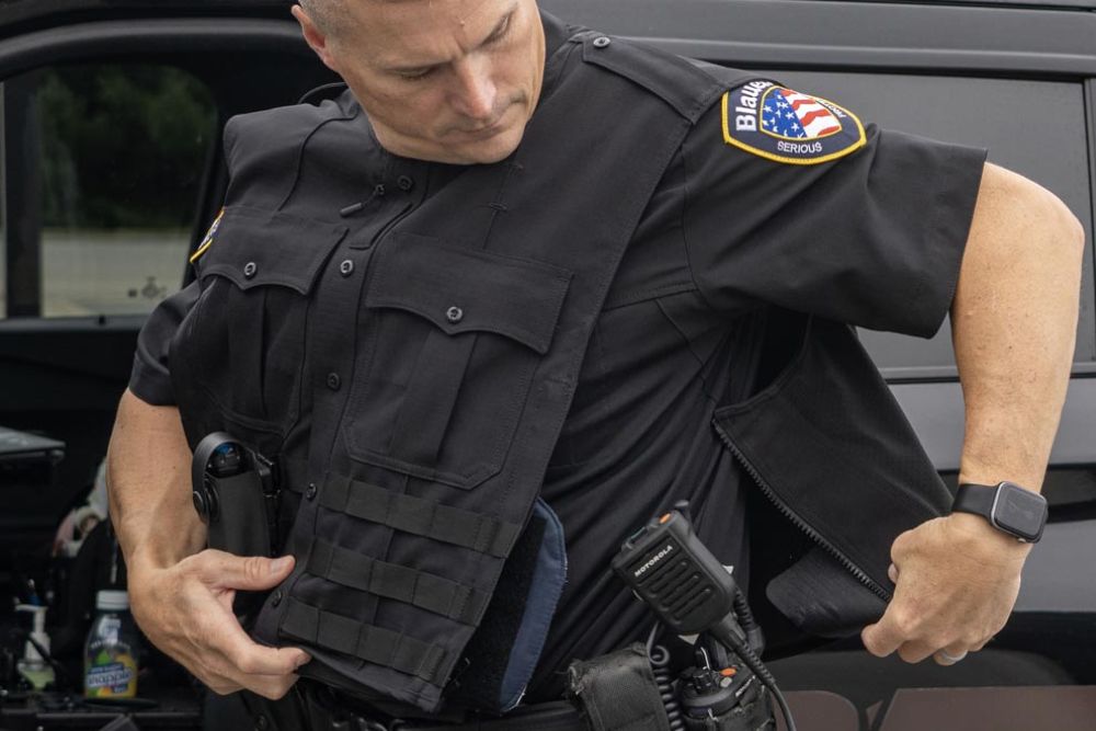 Image of Tactical Officer zipping in to an Armorskin Vest Carrier