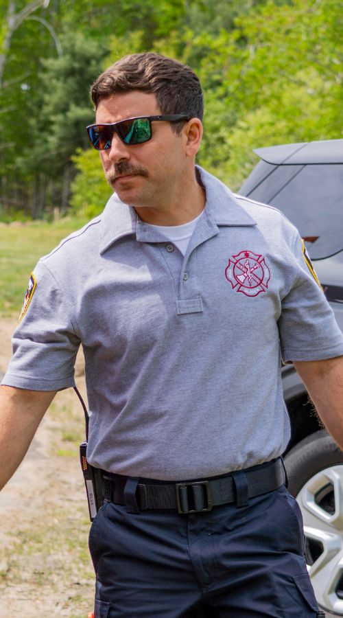 Responder wears the Bicomponent Polo Shirt in Gray