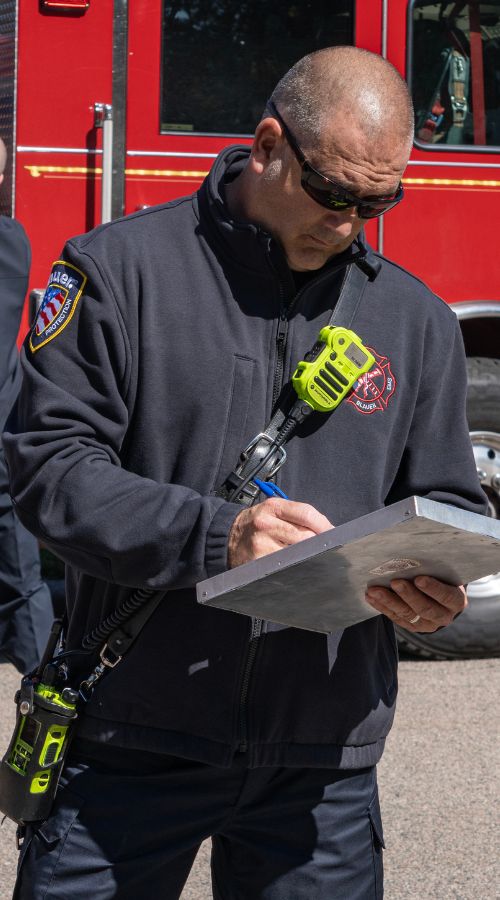 Responder wears the Full Zip Job Shirt outside on a job