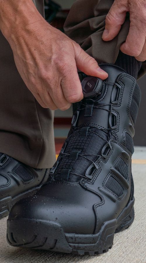 Responder turns the BOA&reg; Dial on their Breach V2 Boot in the station