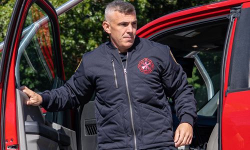 Firefighter at the station wears the Blauer Quilted Bomber Jacket