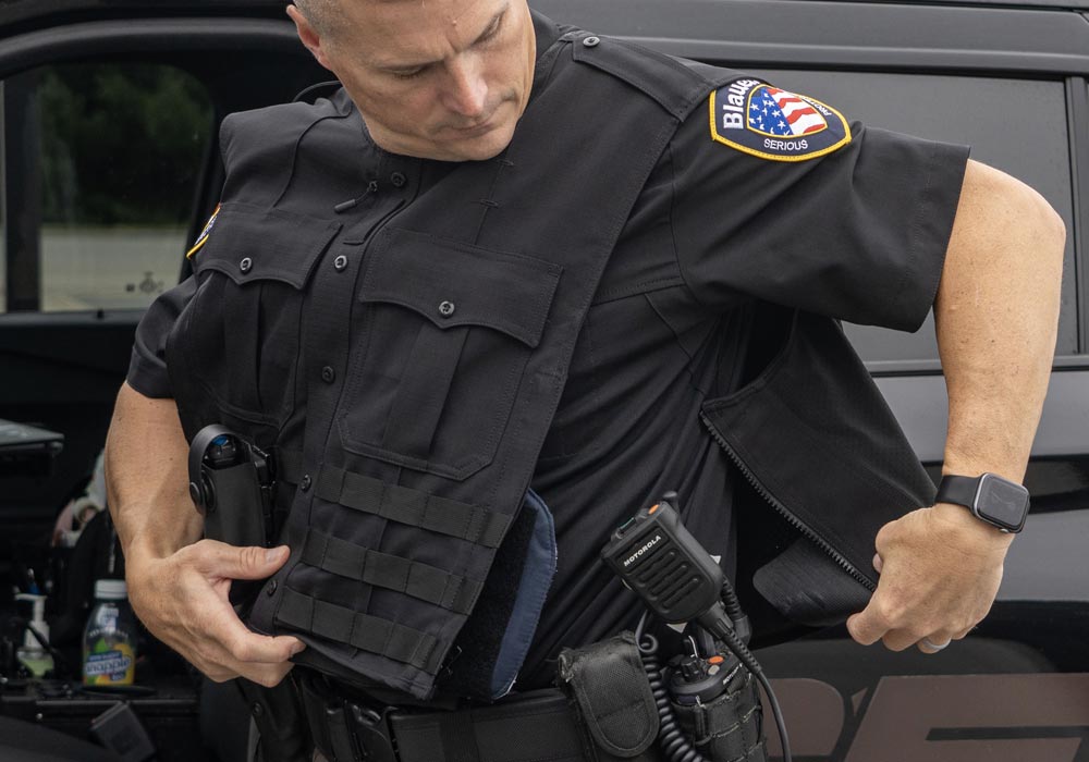 Article Cover- Image of Tactical Officer zipping in to an Armorskin</body>