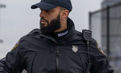 In rainy weather, a bike officer wears a moisture wicking turtleneck and lightweight, weatherproof jacket
